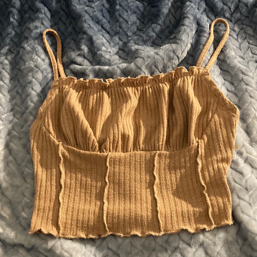 The brand is SHEIN, the color is brown , the size is a small (eu 36, us 4)